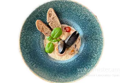 Фірмове соте з морепродуктів з кус-кусом у вершковому соусі Amici Felici undefined фото