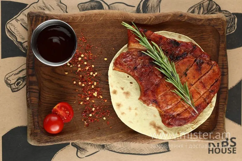 Стейк зі свинини на кістці - "Ribs House" в Рівному фото