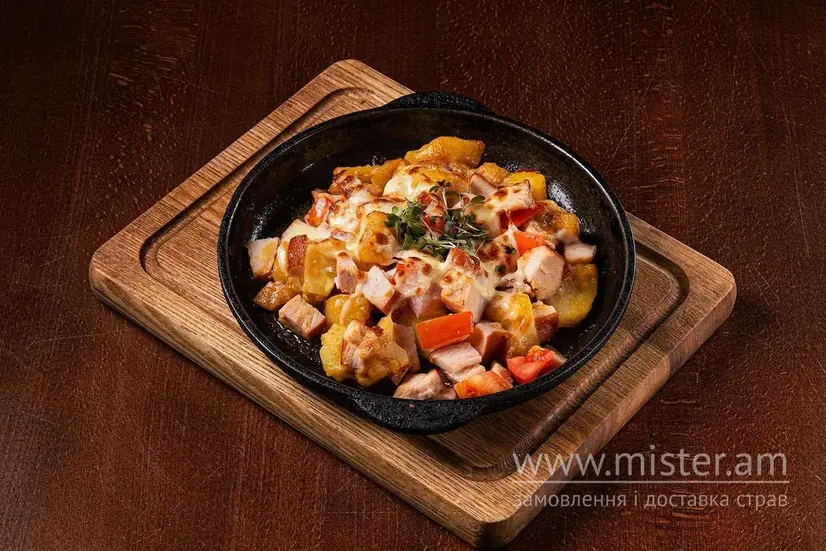 Картопля з куркою та овочами під сиром Моцарелла - "Кухмістерська Хаселева" в Хмельницькому фото